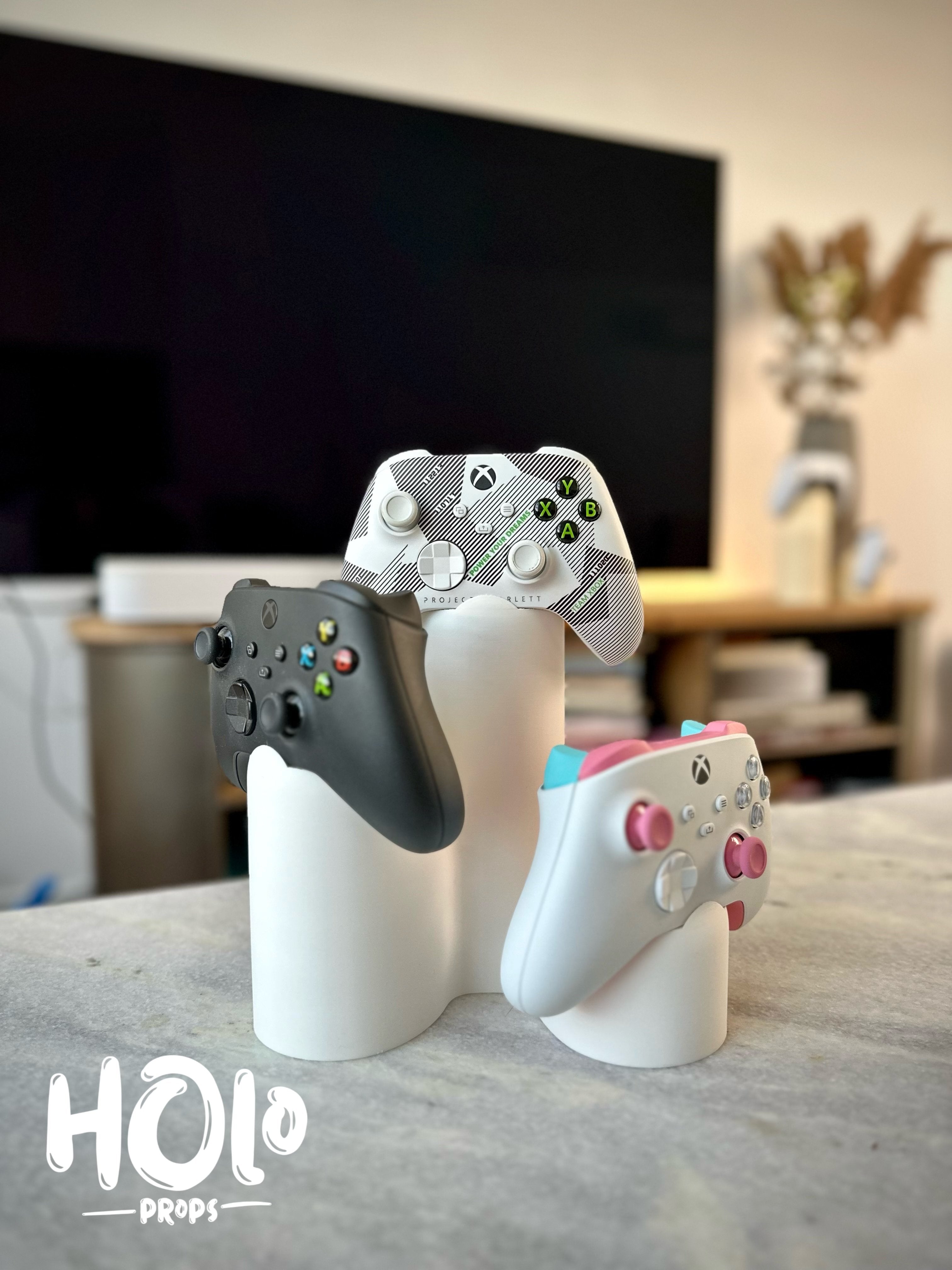 Moderne stand til tre PlayStation Xbox controllere