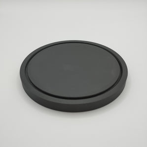 Minimalistisk rund coaster med tilhørende holder
