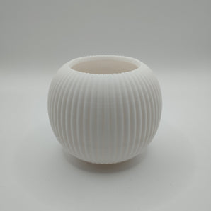 Moderne rund blomsterkrukke med ribbet design