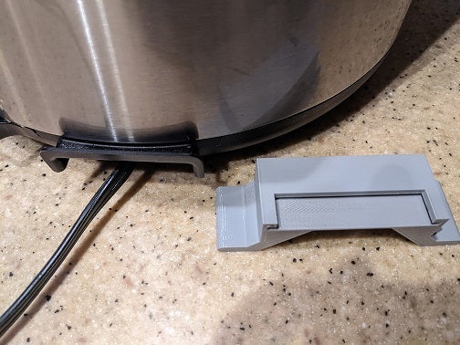 Instant Pot IP-LUX: Praktisk Ledningsholder for Organiseret Opbevaring